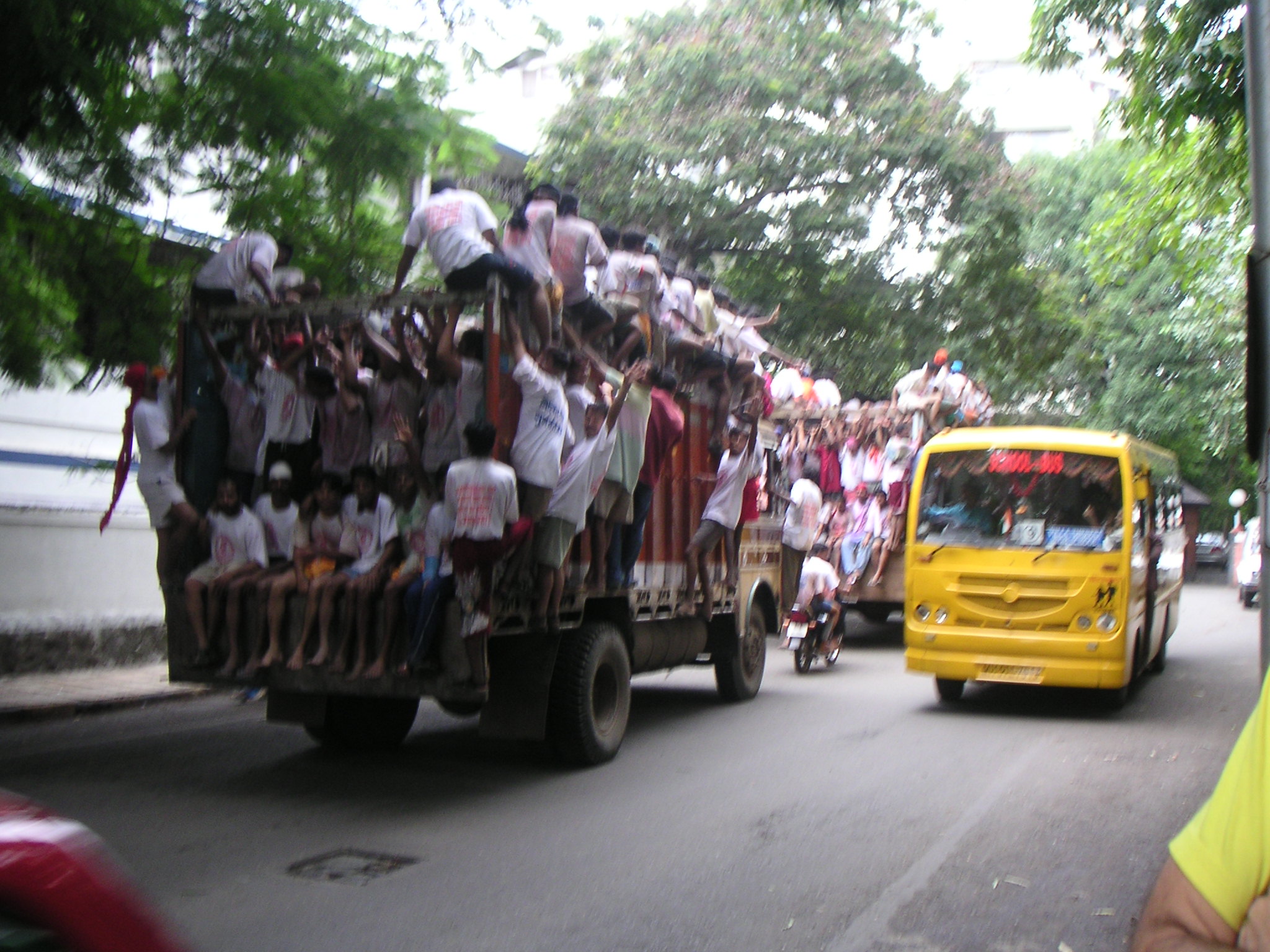 Men on Goods Carrier Going to Krishna Festivities 2.jpg